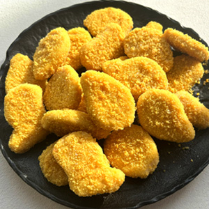 pieces of chicken fillet in breadcrumbs